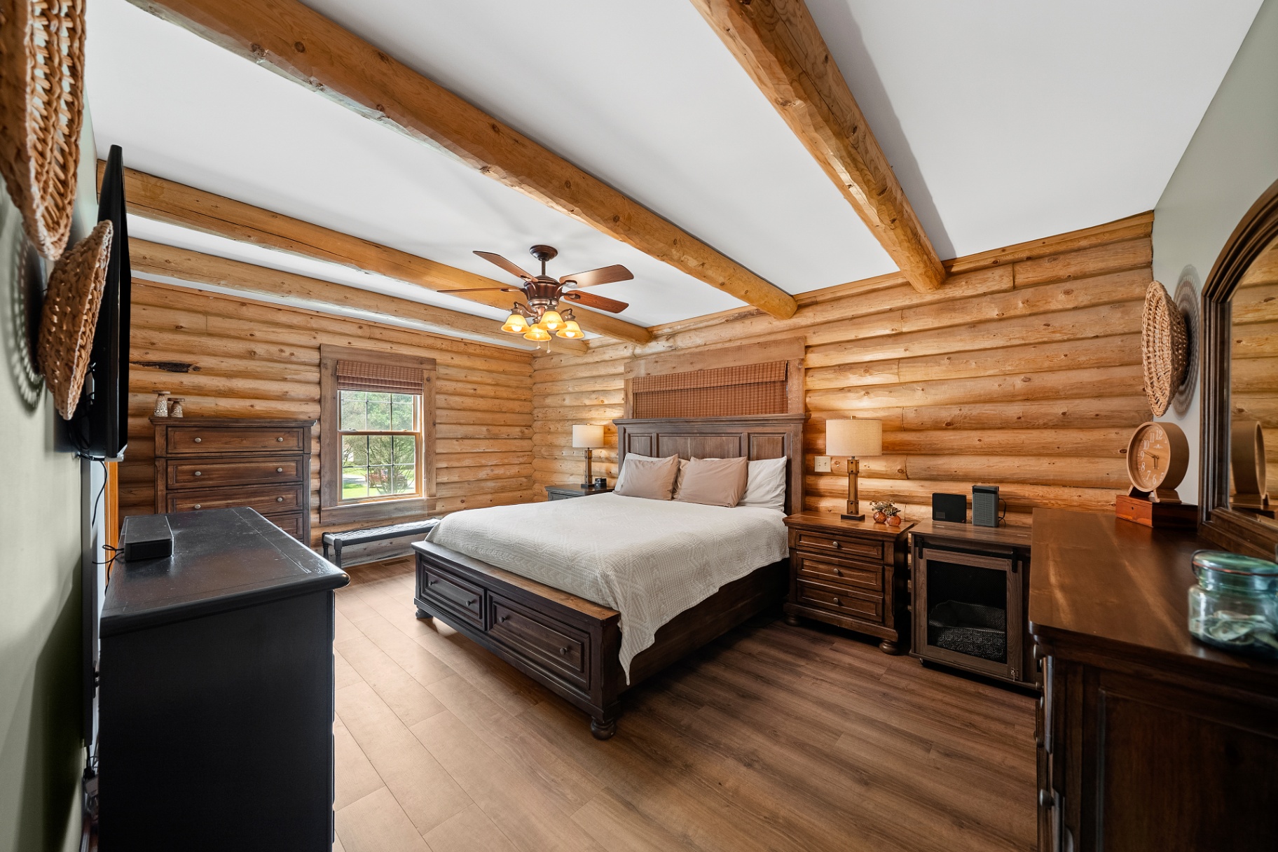 Primary bedroom with log walls